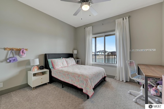 carpeted bedroom with ceiling fan and baseboards