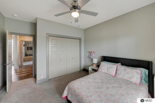 bedroom featuring carpet floors, ceiling fan, baseboards, and a closet