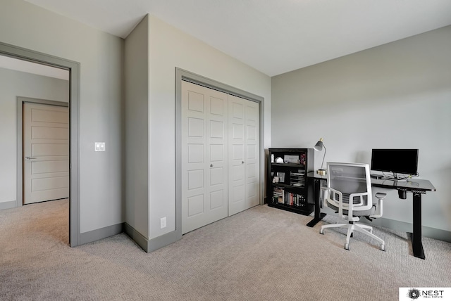 carpeted office with baseboards