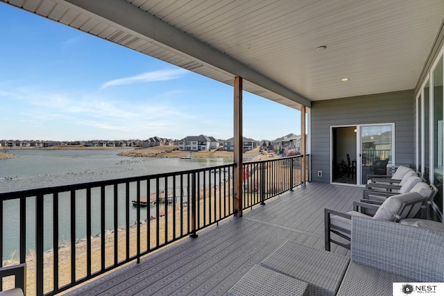 wooden terrace with a water view