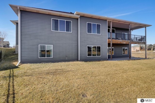 back of property featuring a patio and a yard