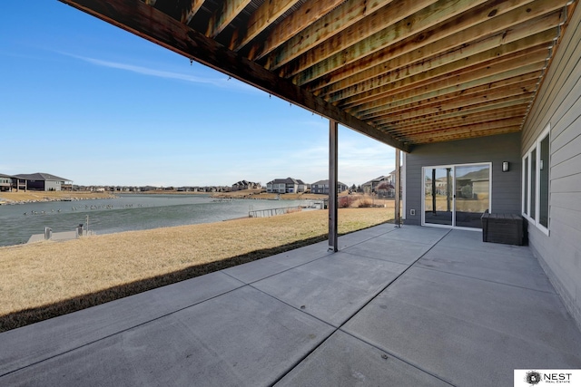 view of patio with a water view