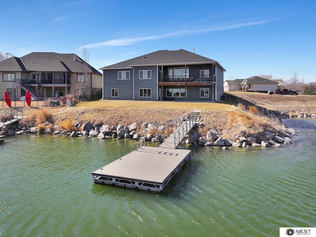 view of dock with a water view and a balcony