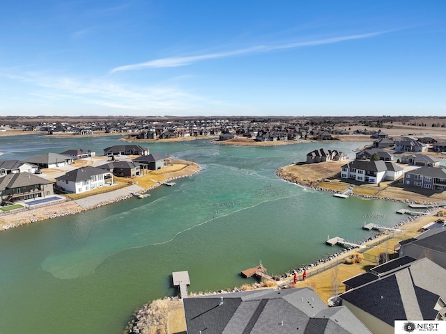 aerial view featuring a water view and a residential view