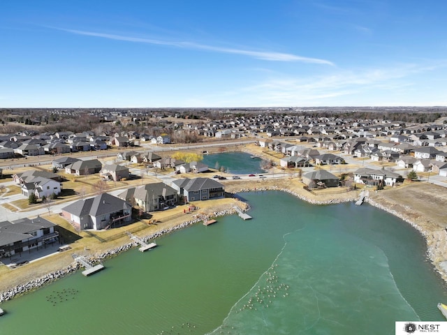 bird's eye view featuring a water view and a residential view