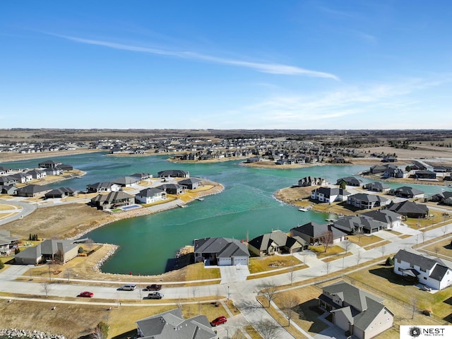 bird's eye view with a water view and a residential view