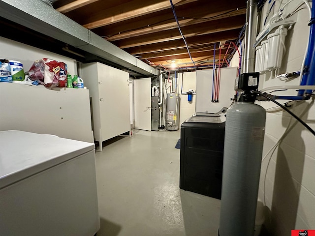 unfinished basement featuring gas water heater and refrigerator