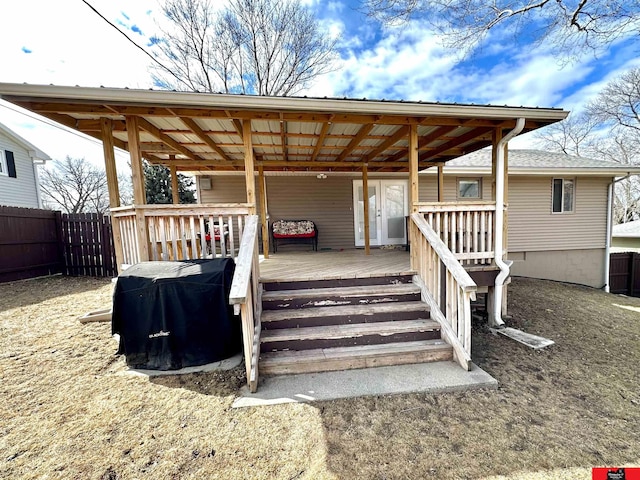 wooden terrace featuring fence and area for grilling