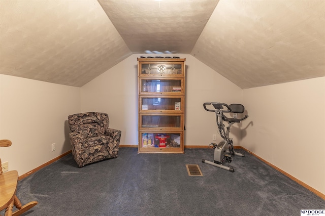 workout room with visible vents, vaulted ceiling, a textured ceiling, and baseboards