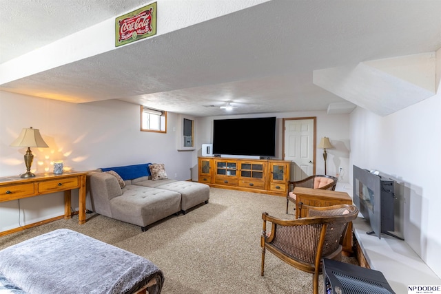 carpeted living room featuring a textured ceiling