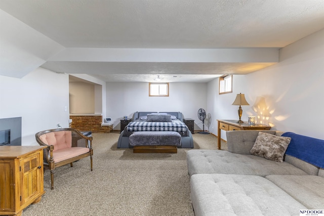 bedroom featuring carpet flooring, a textured ceiling, and baseboards