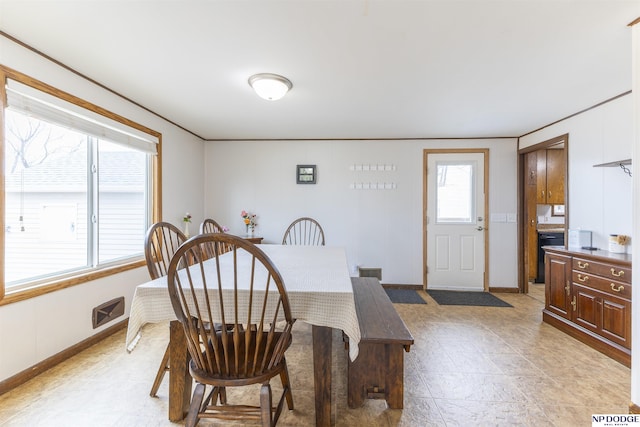 dining room with visible vents and baseboards