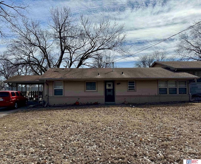 view of front of property with a carport