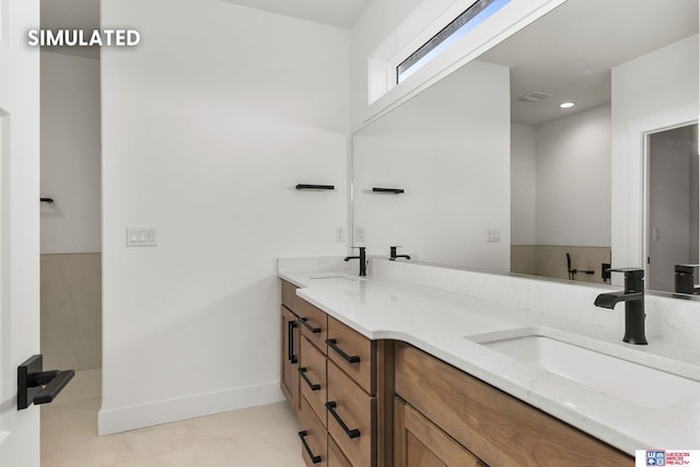 full bath with recessed lighting, a sink, baseboards, and double vanity