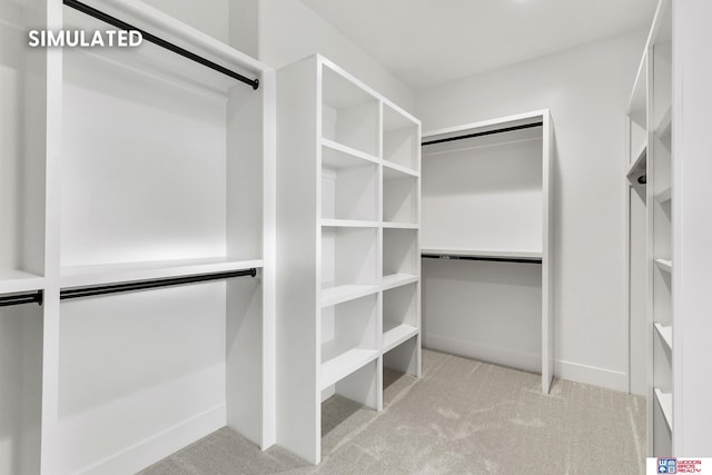 walk in closet with carpet flooring