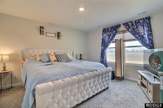 carpeted bedroom with baseboards and visible vents