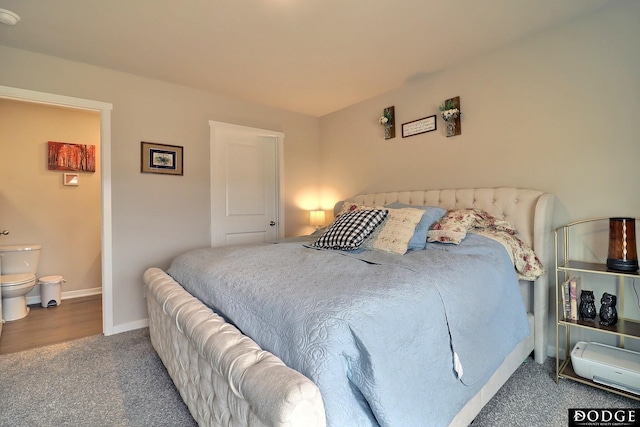 bedroom with carpet floors, ensuite bath, and baseboards