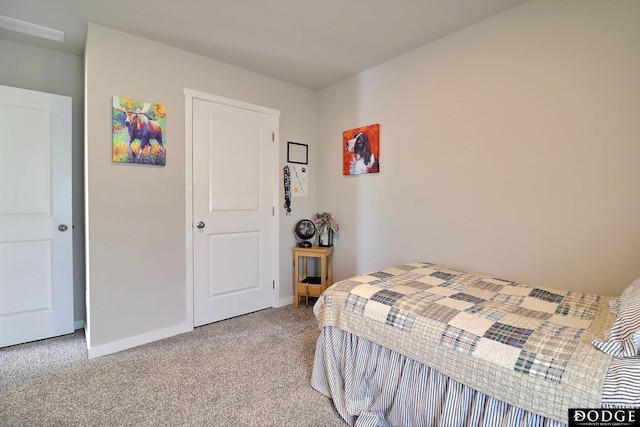 carpeted bedroom featuring baseboards