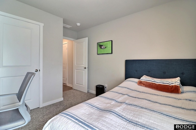 bedroom with carpet floors and baseboards