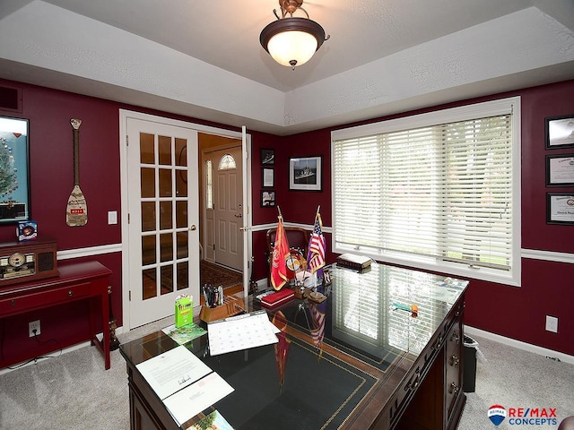 recreation room featuring light carpet, baseboards, and french doors