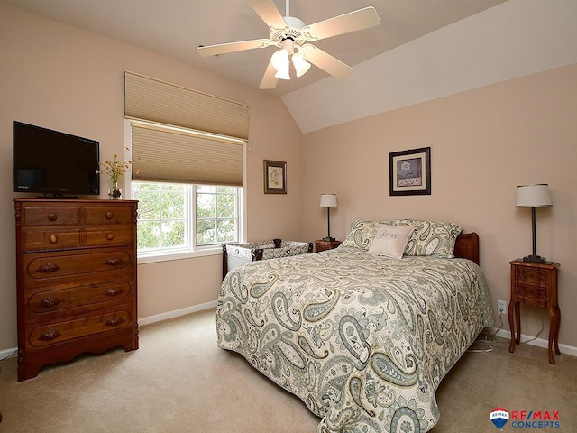 bedroom with lofted ceiling, ceiling fan, baseboards, and carpet flooring