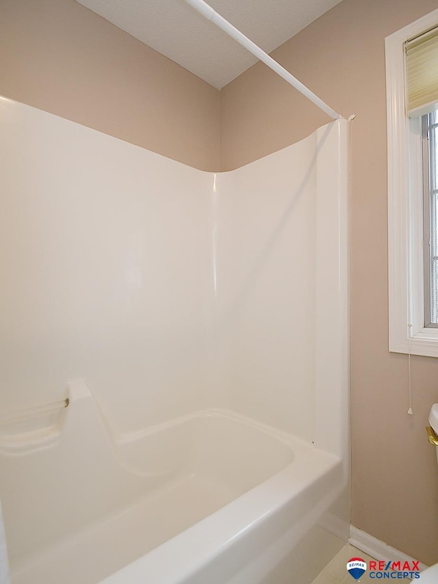 bathroom featuring baseboards