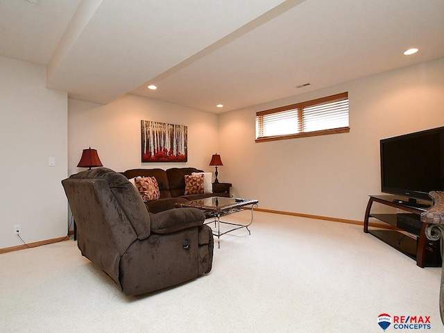 living area featuring carpet, baseboards, and recessed lighting