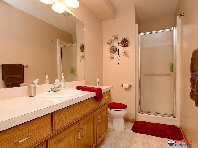 full bathroom with visible vents, toilet, a shower stall, vanity, and baseboards