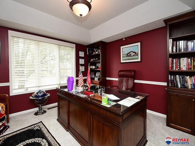 office area with light carpet and baseboards