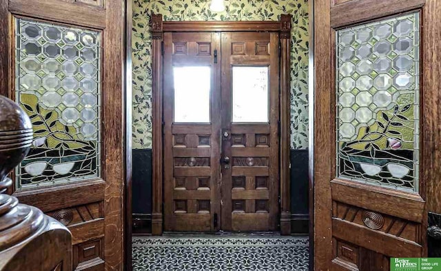 entryway with wallpapered walls