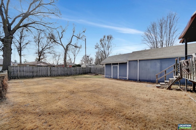 view of yard with a fenced backyard