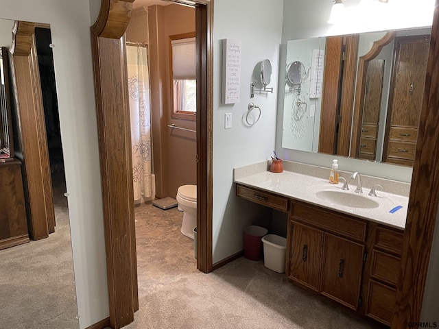 full bathroom with toilet, a shower with shower curtain, and vanity