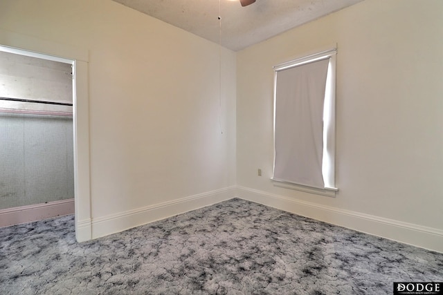 unfurnished bedroom with carpet floors and baseboards