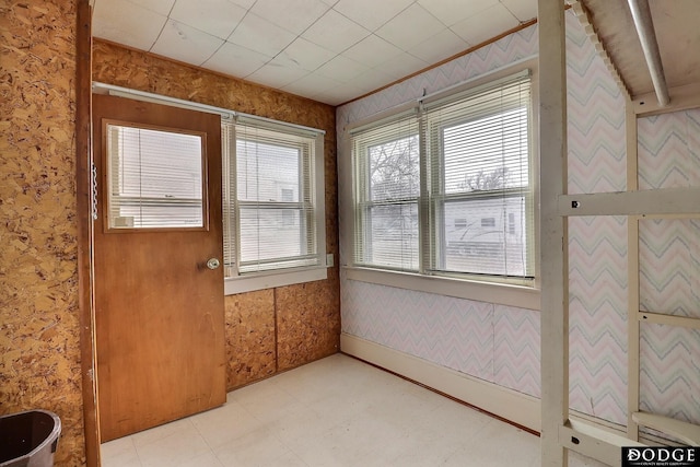 unfurnished sunroom featuring plenty of natural light