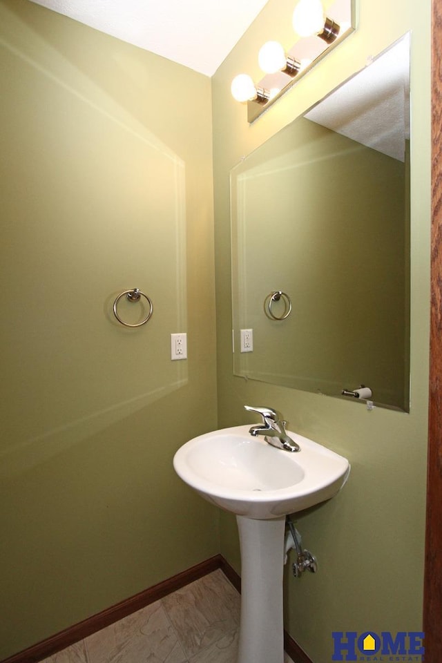 bathroom featuring baseboards