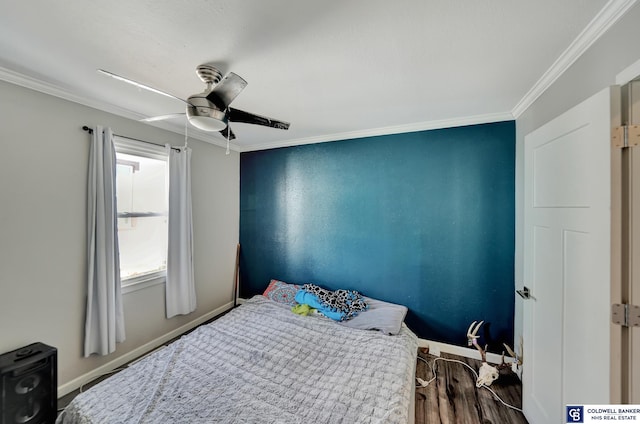 bedroom featuring ornamental molding, ceiling fan, baseboards, and wood finished floors