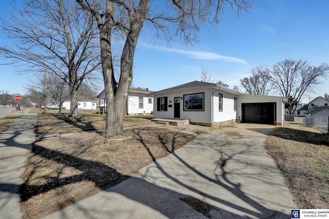 view of front facade with driveway and an attached garage