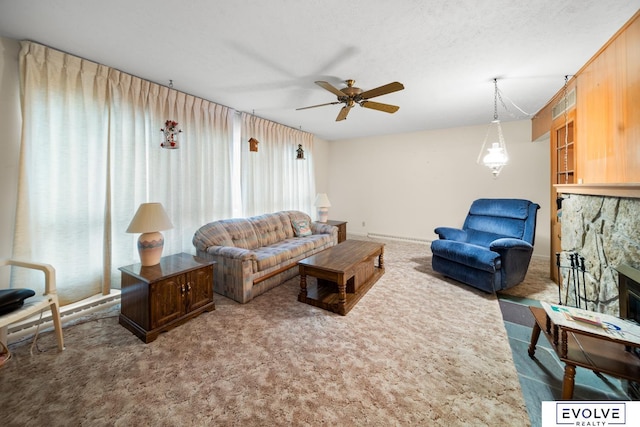 carpeted living room with a fireplace, a textured ceiling, and ceiling fan