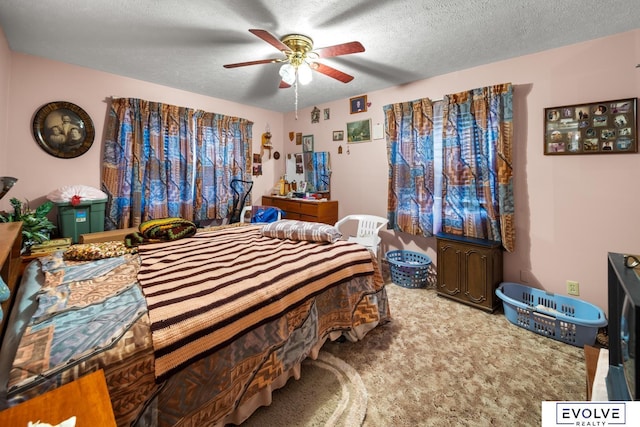 bedroom featuring a textured ceiling and ceiling fan