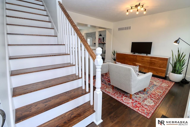 interior space featuring hardwood / wood-style floors and visible vents