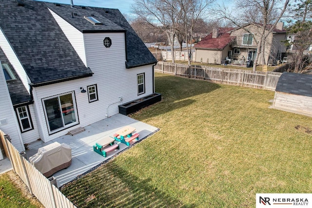 view of yard featuring a residential view, fence, and a patio