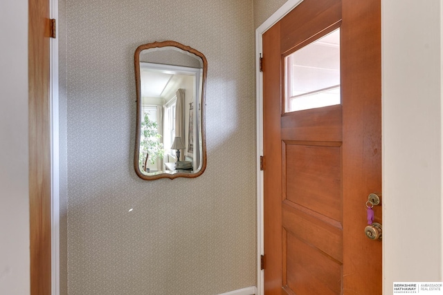 interior space with wallpapered walls