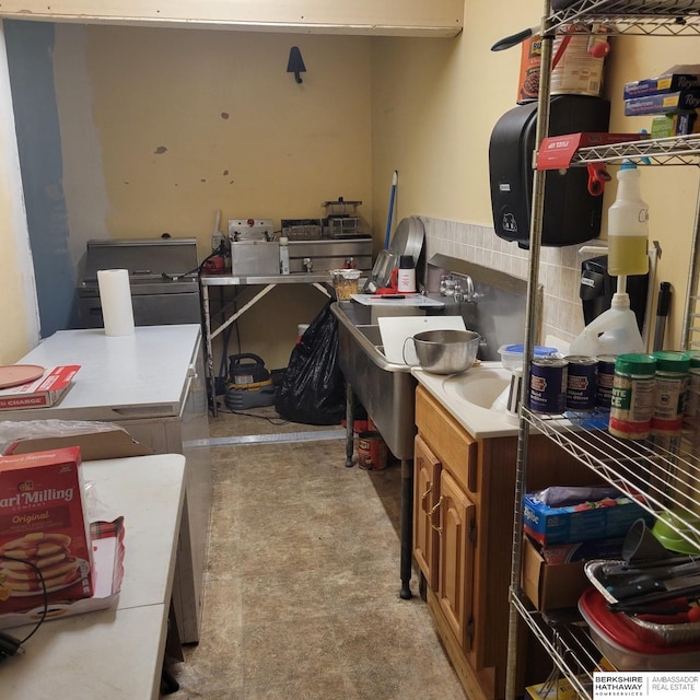 interior space with brown cabinets and light countertops