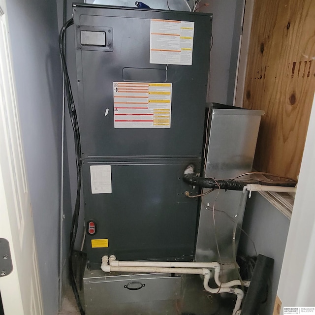 utility room with heating unit