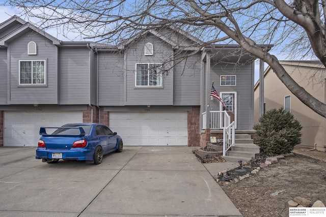 view of front of house featuring a garage and concrete driveway