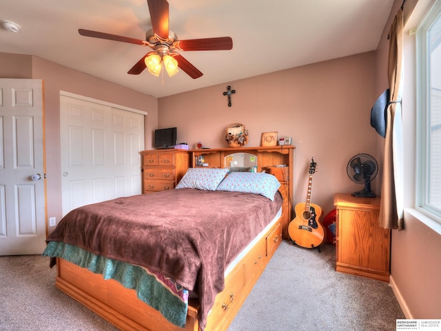 bedroom featuring a closet, carpet, a ceiling fan, and baseboards