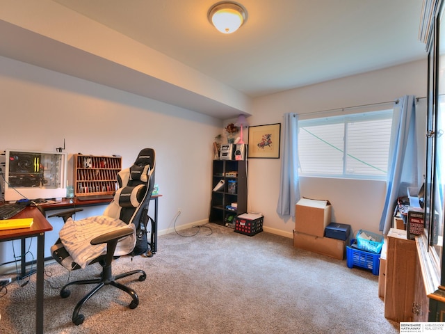 carpeted home office with baseboards