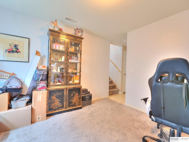 office with carpet, visible vents, and baseboards