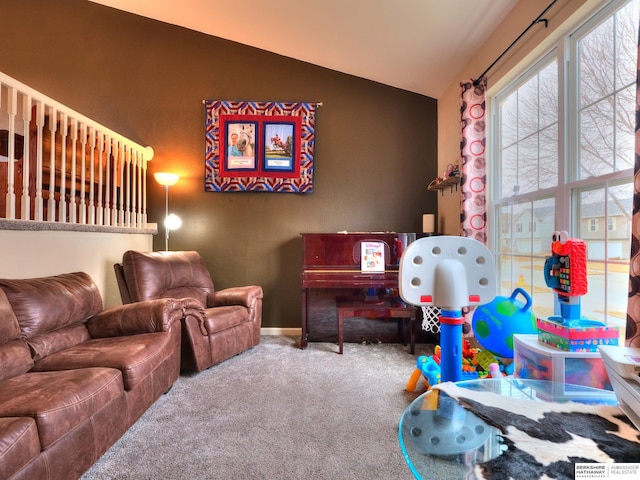 game room featuring carpet, vaulted ceiling, and baseboards