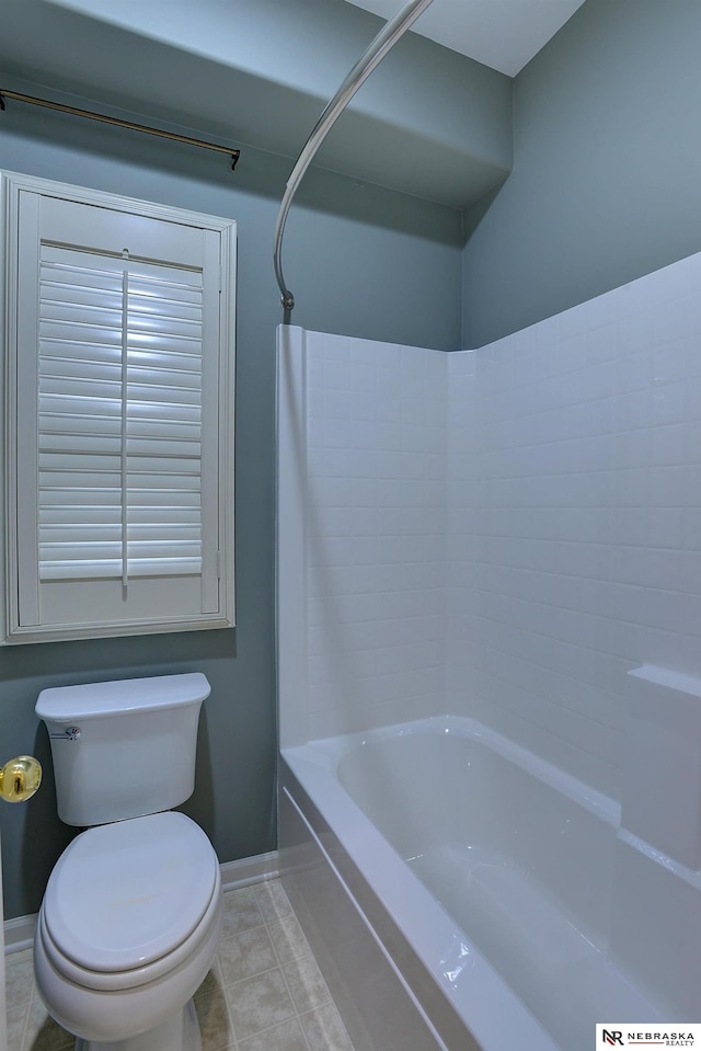 full bathroom with toilet, bathtub / shower combination, baseboards, and tile patterned floors